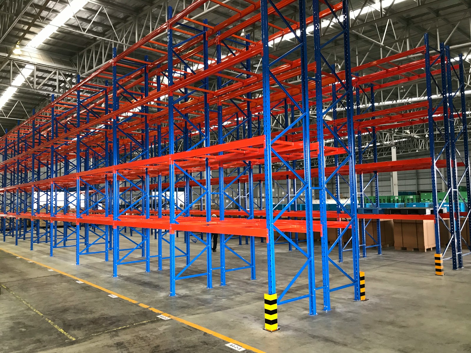 a warehouse with blue and yellow poles