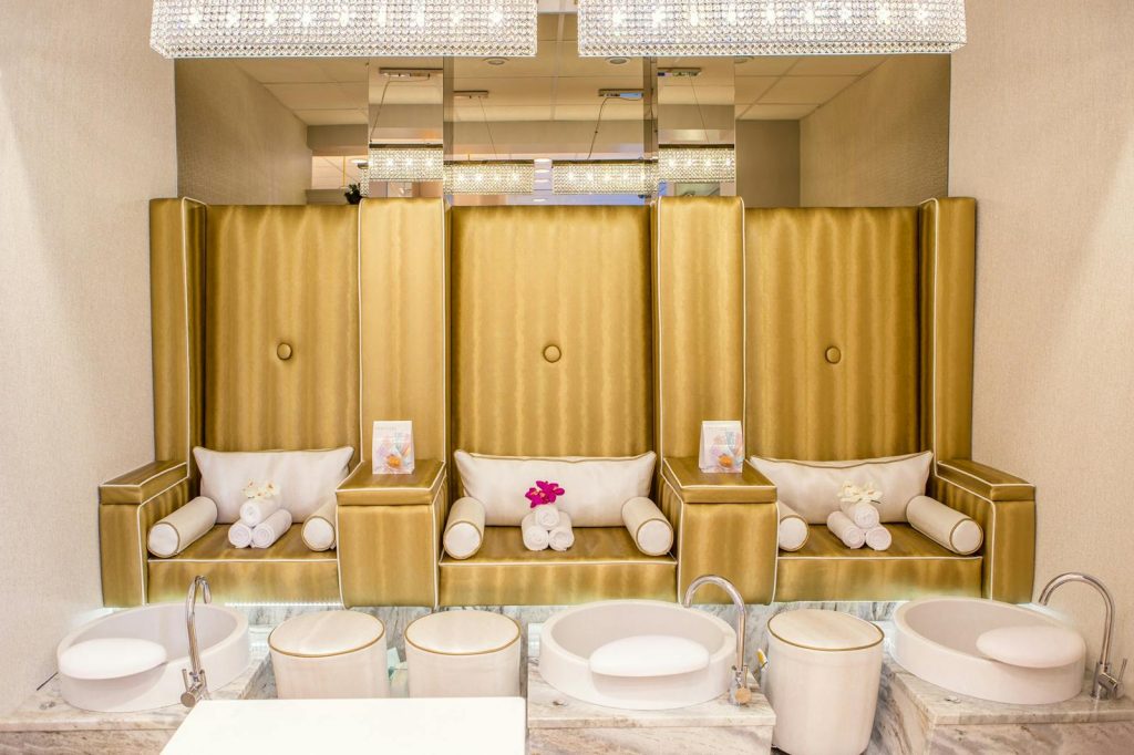 Elegant and contemporary spa interior featuring luxurious pedicure stations for relaxation.