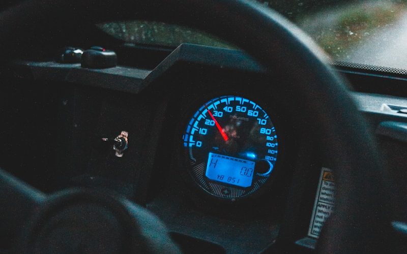 black car steering wheel during daytime