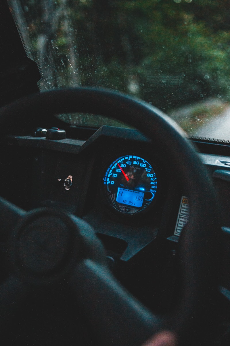 black car steering wheel during daytime